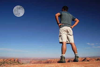 a man staring up at the moon