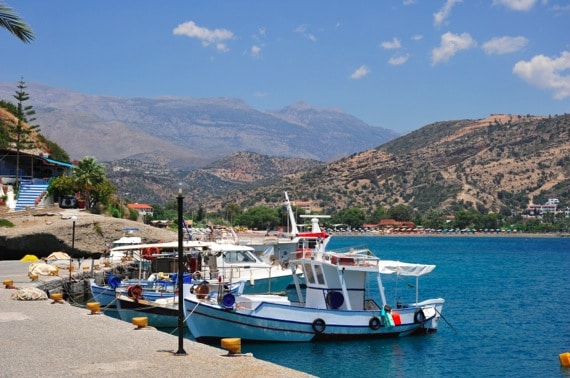 A Pier with Boats in Greece - Photo courtesy of &copy;iStockphoto.com/clubfoto, Image #13426165 