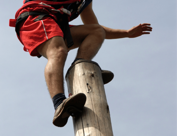 A Man Standing on Top of a Pole - Photo courtesy of ©iStockphoto.com/SLOFotomedia, Image #2939030 A Man Standing on Top of a Pole - Photo courtesy of ©iStockphoto.com/SLOFotomedia, Image #2939030